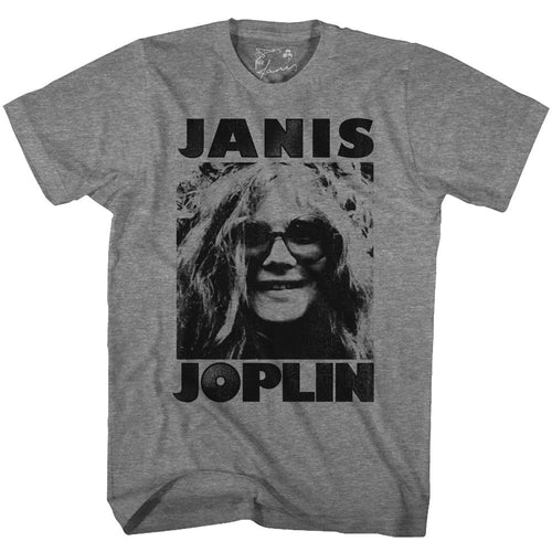 gray janis joplin shirt with logo and picture of janis with big round hippie glasses on, smiling