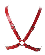 Load image into Gallery viewer, back of Red vegan leather inverted pentagram harness with O rings and adjustable straps at the back.
