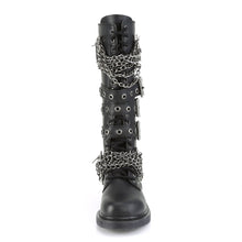 Load image into Gallery viewer, front view of black vegan leather knee high combat boot with 1.25&quot; heel, 20 eyelet lace-up, brass knuckle with chain on top of shoe and base of shoe with three adjustable straps in the middle, full zipper on backside
