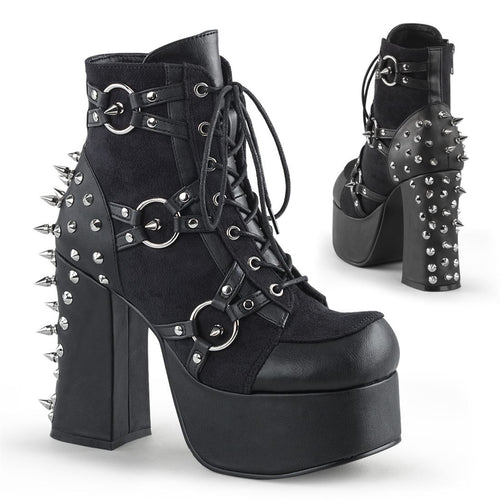 right and backside view of black vegan leather with suede panels 4.5 inch heel ankle boot with three O ring designs with spike in middle on each side of boot, tree spikes and s tuds on the back and 7 eyelet lace-up front 