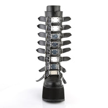 Load image into Gallery viewer, front side view of black vegan leather 3.5&quot; platform knee high boot. Features 8 buckle straps w/ metal plates at center with back metal zip closure
