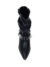 Load image into Gallery viewer, top view of Women&#39;s black vegan mid-calf pull on boot with attached black vegan leather bootstrap. Outer side of bootstrap has a silver O ring. Bootstrap has detachable silver chain that goes underneath boot. Front and back of boot strap have two rows of silver spikes. Black rubber outsole.
