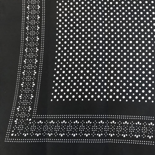 Black bandana with white polka dot patterns.
