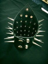 Load image into Gallery viewer, triangular shaped black leather gauntlet bracelet with multiple rows of two inch silver needle spikes. shows snap closure

