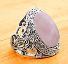 Load image into Gallery viewer, side of Silver colored ring with oval natural pink quartz stone.
