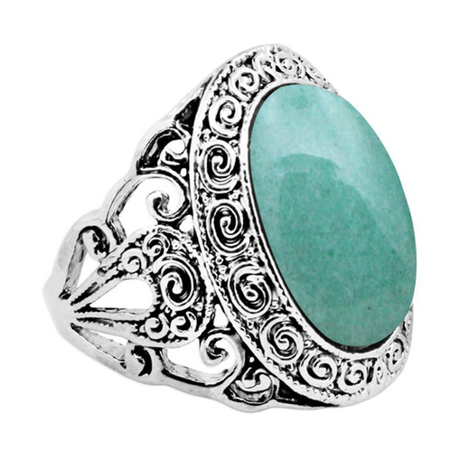 Silver colored ring with oval natural jade stone.