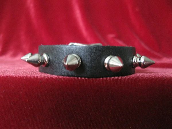 black leather bracelet with multiple silver spike studs