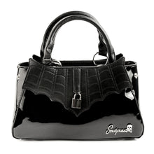 Load image into Gallery viewer, front view of Glossy black purse with silver lock detail on front center. The shell is comprised of glossy black faux leather, with matte leather stitched spiderweb details near the top. Zip closure, inner pockets and little metal feet.
