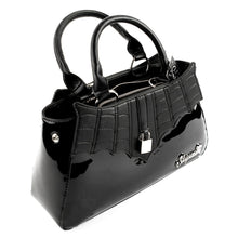 Load image into Gallery viewer, side view of Glossy black purse with silver lock detail on front center. The shell is comprised of glossy black faux leather, with matte leather stitched spiderweb details near the top. Zip closure, inner pockets and little metal feet.
