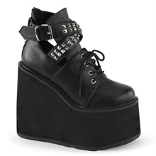 Load image into Gallery viewer, outer side view of black vegan leather 5.5&quot; wedge platform Mary Jane style Lace-up front Wrap around style studded adjustable strap around ankle
